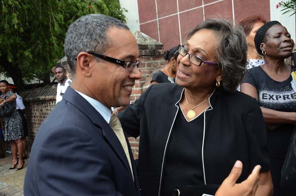 Rudolph Brown/Photographer
Christopher Barnes Managing Director of The Gleaner Company greets Lady Hall at the funeral service for the late Anthony Abrahams at St. Andrew Parish Church on Wednesday, August 17-2011