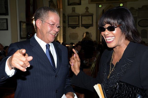Rudolph Brown/Photographer
Prime Minister Bruce Golding chat with Opposition Leader Portia Simpson Miller at the funeral service for the late Anthony Abrahams at St. Andrew Parish Church on Wednesday, August 17-2011