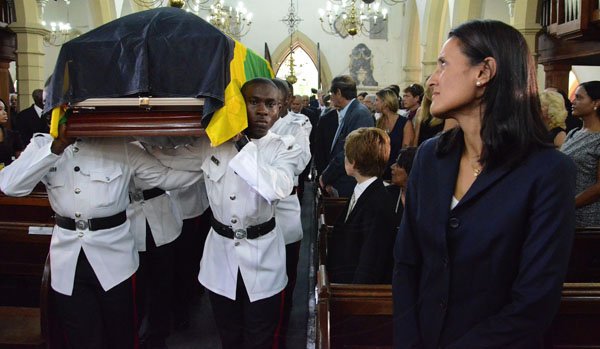 Rudolph Brown/Photographer
Tara Abrahams-Clivio, (right) daughter at her father funeral service for the late Anthony Abrahams at St. Andrew Parish Church on Wednesday, August 17-2011