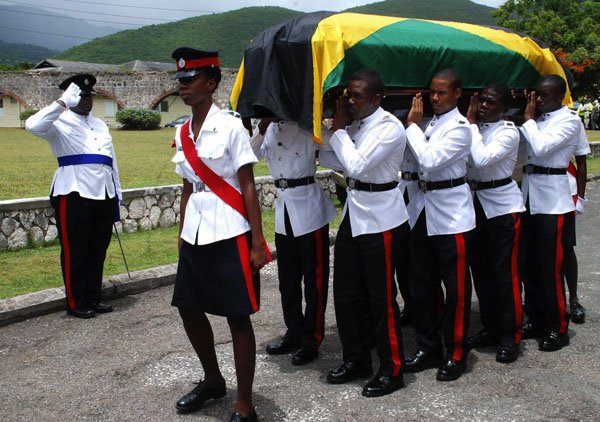 Colin Hamilton/Freelance Photographer
The Official funeral service,Remembrance and Thanksgiving of the late Arthur Williams Snr. OD, JP. at the UWI Chapel, Mona on Friday July 6, 2012.

Pall Bearers from the Jamaica Constabulary Force carry the casket on it's last journey. 
