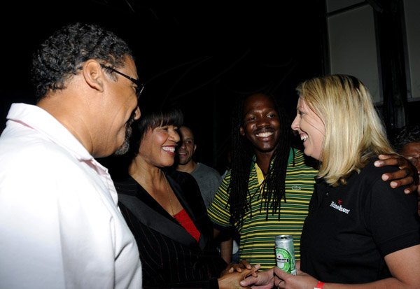 Winston Sill / Freelance Photographer
The Ministry of Tourism  presents Arts In The Park Concert, held at Hope Gardens, Old Hope Road on Sunday night February 24, 2013. Here are Minister Wykeham McNeill (left); Prime Minister Portia Simpson-Miller (second left); Junior Minister damion Crawford (second right); and Marguerite Cremin (right), Head of Corporate Relations, Heineken.