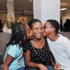 Ashley AnguinJean-Ann Buddle gets some love from her children  Jehanna Goldson (right) and her brother Antonio. *** Local Caption *** Ashley AnguinJean-Ann Buddle gets some love from her children  Jehanna Goldson (right) and her brother Antonio.