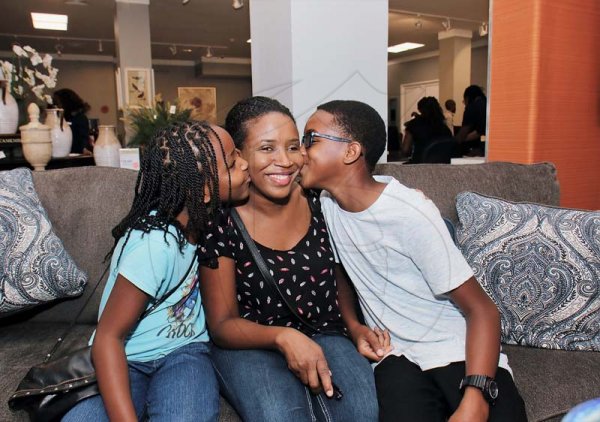 Ashley AnguinJean-Ann Buddle gets some love from her children  Jehanna Goldson (right) and her brother Antonio. *** Local Caption *** Ashley AnguinJean-Ann Buddle gets some love from her children  Jehanna Goldson (right) and her brother Antonio.