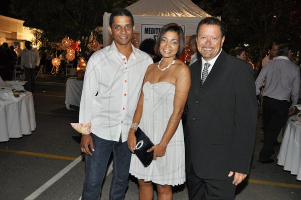 Janet Silvera Photo  
 
From L- Harold and Denise Williams and ATL's Andrew Brennan at the opening of ATL Automobile store at Bogue City Centre in Montego Bay last Friday night.