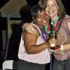 Janet Silvera
Digicel's Olive Lawson (right) hugs guest of honour former co-worker Audi Allen-Lawson after presenting her with one of 10 awards at farewell party at the Aquasol Theme Park, Montego Bay, last Friday night in Montego Bay