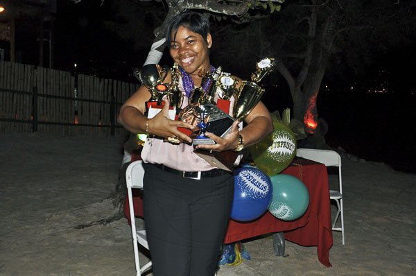 Janet Silvera Photo
 
Outgoing Digicel sales executive, Audi Allen poses with her 10 trophies and plaques during a farewell function in her honour at the Aquasol Theme Park, Montego Bay, last Friday night