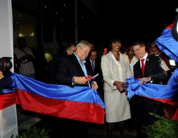 Winston Sill / Freelance Photographer
Prime Minister Portia Simpson-Miller officially open ATL Automotive, Volkswagen and Audi Showrooms, held at Oxford Road, New Kingston on Friday night April 19, 2013. Here Gordon "Butch" Stewart (left); Prime Minister Portia Simpson-Miller (centre); and Adam Stewart (right) cuts the ribbon to open the showrooms.