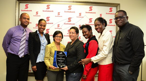 Gladstone Taylor / Photographer

Omar Spence (Manager, Marketing Programmes), Terri-Karelle Reid (Online Brand Manager, Gleaner Company), Monique Todd (Vice President .Marketing),  Shelley Sykes-Coley (Sponsorships Manager), Nordia Johns-Brown (Top Online Sales Rep, Gleaner Company),  Simone Walker (Regional Marketing Manager Wealth Division) and Rainford Wint (Head of Online Sales, Gleaner Company)

Presentation of gleaner award to scotia online marketing for top billing online advert agency for 2012