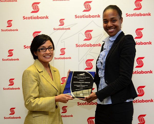 Gladstone Taylor / Photographer

Monique Todd (Vice President Marketing) (left) and Terri-Karelle Reid (Online Brand Manager, Gleaner Company)

Presentation of gleaner award to scotia online marketing for top billing online advert agency for 2012