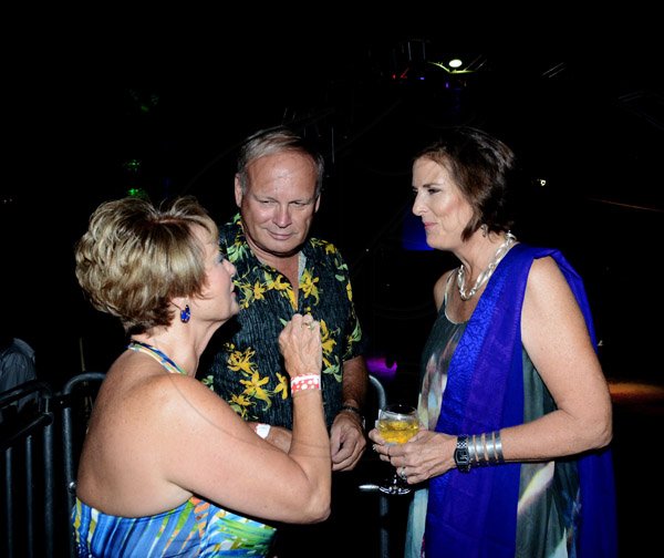 Winston Sill/Freelance Photographer
The American Women's Group of Jamaica (AWGJ) host Escapade Party, held at AISK, College Green Avenue, Hope Pasters on Saturday night May 17, 2014. Having conversation over champagne are Becky Stockhausen (left) Steve Morgan (middle) and Julie Jones