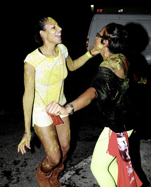 Winston Sill / Freelance Photographer
Bacchanal Jamaica and Appleton Jamaica Rum J'ouvert  and Road Parade under the theme "Alien Invasion", featuring Destra Garcia, held at The New Mas Camp, Stadium North on Friday night until daylight April 13, 2012.. Here is WYSINCO's Tamara Ward (left) and a friend.