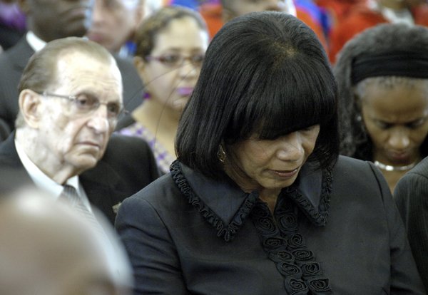 Ricardo Makyn/Staff Photographer.
 Left Former Prime Minister The Most Honourable Edward Seaga and Leader of the Opposition the Hon Portia Simpson Miller  at the Funeral Service for the late Alston Barrington Chevannes,OJ,CD at the UWI Chapel on Monday 15.11.2010.
