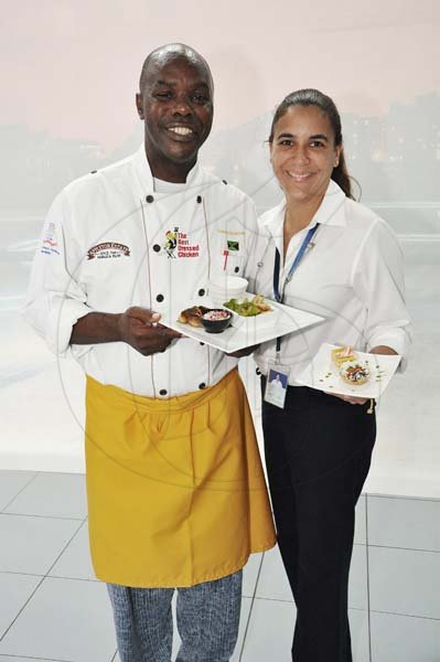 Jermaine Barnaby/Photographer
Chef Dennis McIntosh (left) and Jacqueline Sangster General Manager Silver Star Motors show off the meals served at The New E-Class Sedan launched on Monday, September 9, 2013 Silver Star Motors Limited, South Camp Rd, Kingston.