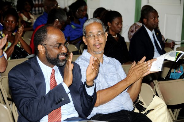 Gladstone Taylor/Photographer

General Manager of Jamaica National Building Society Earl Jarrett (left) and Social Development Commission Chairman Paul Burke enjoying the festivities at the National Best Community Competition awards ceremony held at the Stella Maris Pastoral Centre yesterday. August 23