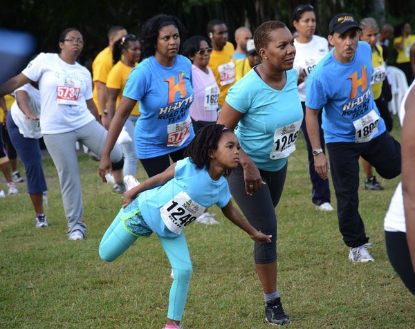 Rudolph Brown/Photographer                                                                                                                                                 Alexandra Anderson warm up beside her mother Althea Bartley at the Best Dressed Chicken 5K road race at Hope Gardens in Kingston on Sunday, March 24, 2013
