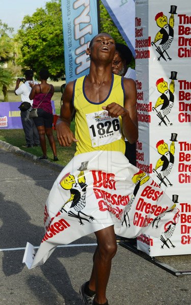Rudolph Brown/Photographer                                                                                                                                                 Best dressed 5K Race............................................................ Gorreld Gordon, winning male of the Best Dressed Chicken 5K road race at Hope Gardens on Sunday, March 24, 2013