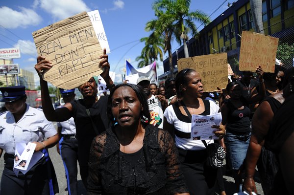 Ricardo Makyn/Staff Photographer
Women's Group's members of the Political directorate and citizen's participate in the Black Friday march against Rape  and sexual crimes from Half Way Tree to Cross roads