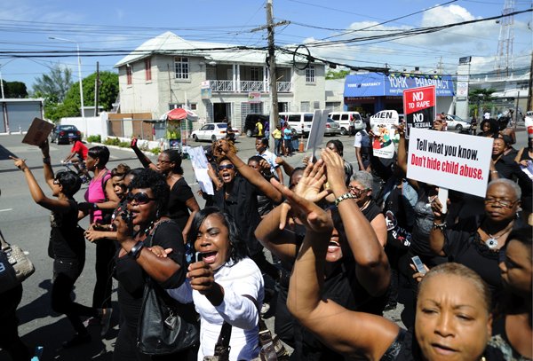 Ricardo Makyn/Staff Photographer
Women's Group's members of the Political directorate and citizen's participate in the Black Friday march against Rape  and sexual crimes from Half Way Tree to Cross roads