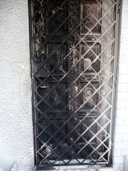 The door to deejay Blak Ryno's Winchester Court apartment, which was firebombed on Wednesday March 3, 2010.
