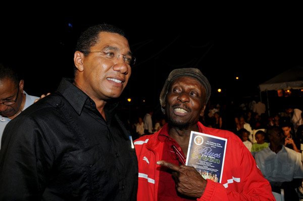 Winston Sill / Freelance Photographer
The Embassy of the United States of America presents Blues on The Green featuring 'Traces of Blue', held at Emancipation Park, New Kingston on Friday night February 22, 2013. Here are Andrew Holness (left); and Jimmy Cliff (right).