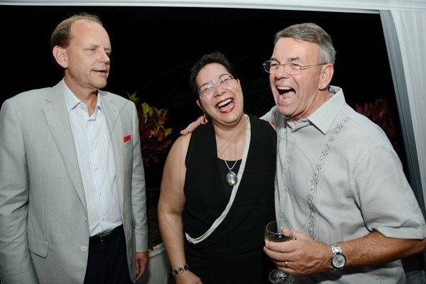 Rudolph Brown/Photographer
Claude Norfolk, (right) share a joke with Shelley Sykes-Coley and Head of International Banking in Toronto, Dieter Jentzat at a dinner in honour of Bruce Bowen hosted by the Chairwoman of the Bank's board, Mrs. Sylvia Chrominska and the Head of International Banking in Toronto at Tavistock Terrace in Jack's Hill on Wednesday, August 28, 2013