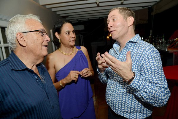 Rudolph Brown/ Photographer
Charles Johnston, Chairman of the Jamaica Producers Group and wife Lisa chat with outgoing CEO of Scotiabank Bruce Bowen, (right) at a dinner in honour of him hosted by the Chairwoman of the Bank's board, Mrs. Sylvia Chrominska and the Head of International Banking in Toronto at Tavistock Terrace in Jack's Hill on Wednesday, August 28, 2013