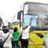 Jermaine Barnaby/Photographer
Persons block the path of a JUTC bus in Half Way Tree as they carried out a march down towards the NWA corporate office on Maxfield Avenue  against bus fare increase on Monday August 25, 2014.