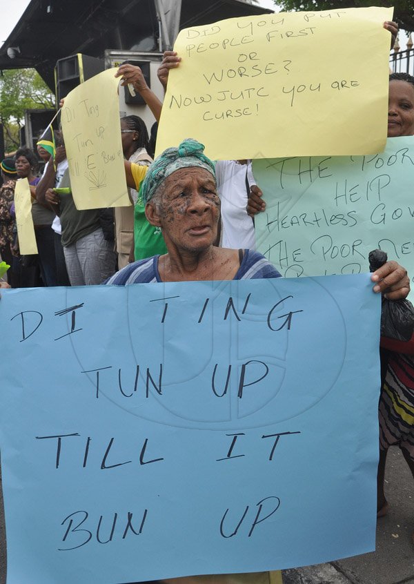 Jermaine Barnaby/Photographer
Seventy year old Hulia Linton was among demonstartors protesting against bus fare increase in Half way Tree on Monday August 25, 2014.
