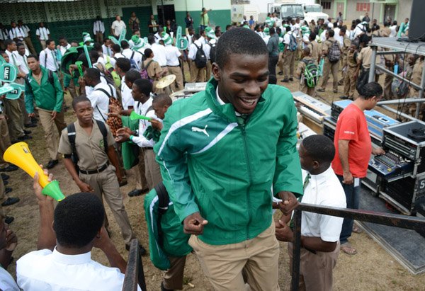 Rudolph Brown/Photographer
Calabar High School captain and star performer, Michael O’Hara enter the stage at the Calabar high school celebration at the school after their victory on Saturday at champs, March 28, 2015.