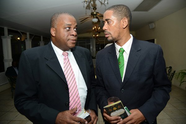 Rudolph Brown/Photographer
Keith White, (left) President of Calabar Old Boys Association, (COBA), chat with Michael Roofe, Chairman of Dinner Committee at the Calabar Old Boys Annual Reunion Dinner at the Mona Visitors Lodge on Saturday, October 5, 2013