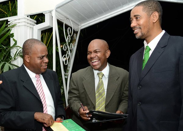 Rudolph Brown/Photographer
Dervan Malcolm, (centre) share a joke with Keith White,(right) President of Calabar Old Boys Association, (COBA) and Michael Roofe, Chairman of Dinner Committee at the Calabar Old Boys Annual Reunion Dinner at the Mona Visitors Lodge on Saturday, October 5, 2013