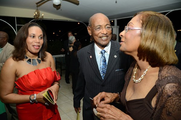 Rudolph Brown/Photographer
Hugh Williams chat with Dorothea Williamson, (right) and Janet Gibbs at the Calabar Old Boys Annual Reunion Dinner at the Mona Visitors Lodge on Saturday, October 5, 2013