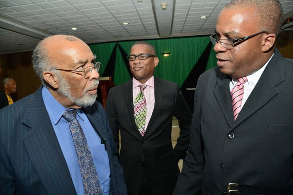 Rudolph Brown/Photographer
Michael Roofe,(right) Chairman of Dinner Committee chat with Bartholomew Philpotts-Kerr, (left) and George Roper at the Calabar Old Boys Annual Reunion Dinner at the Mona Visitors Lodge on Saturday, October 5, 2013