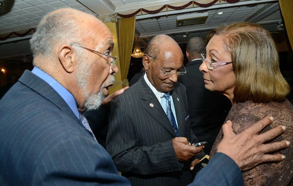 Rudolph Brown/Photographer
Dorothea Williamson, chat with Hugh Williams (centre) and Bartholomew Philpotts-Kerr at the Calabar Old Boys Annual Reunion Dinner at the Mona Visitors Lodge on Saturday, October 5, 2013