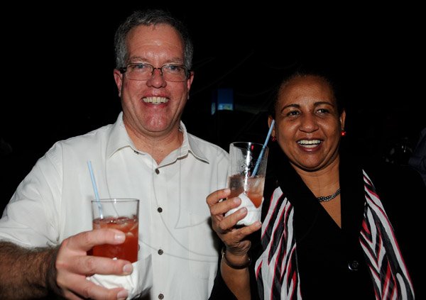 Winston Sill/Freelance Photographer
Canadian Highj Commissioner Robert Ready and wife Joanne Ready host Canada Day Reception, held at Seymour Avenue on Monday night July 1, 2013. Here are High Commissioner Ready (left); and Greta Bouges (right), of Wray and Nephew with a special drink done by Wray and Nephew for Canada 146th Anniversar.