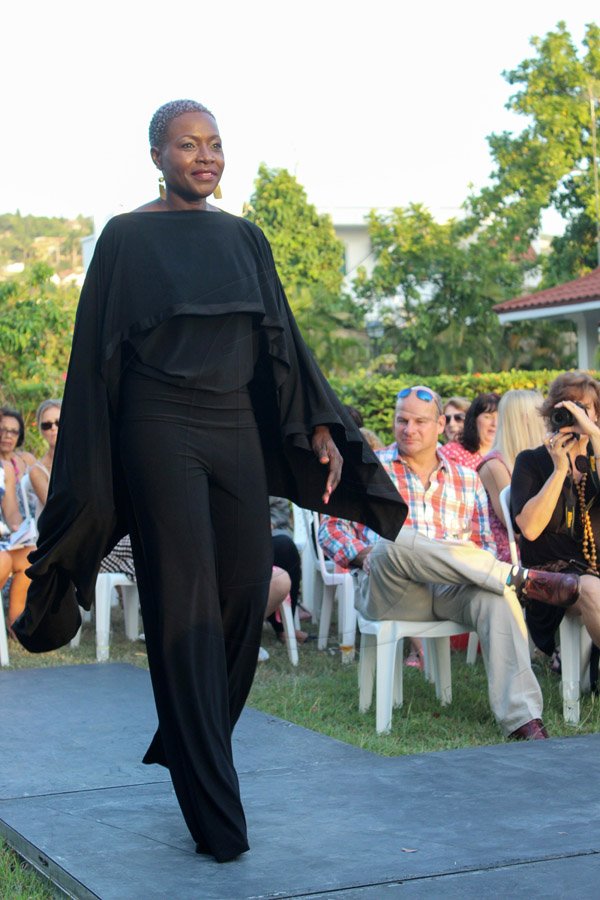 Sandra Kennedy hit the spot for black lovers with this jump suit and cape ensemble. If you are not a cape woman it is removable.