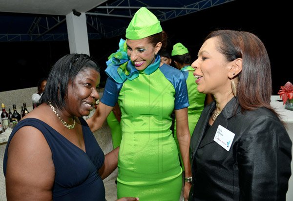 Rudolph Brown/Photographer
7th Heaven Frequent Flyer Cecile Bryan, (left) chat with  Laila Bennett, (centre) and Alecia cabrera, Senior Marketing Manager at the Caribbean Airlines awards and Corporate Event at the Jamaica Pegasus Hotel on Friday, November 15, 2013
