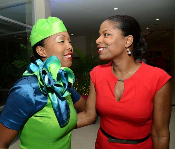 Rudolph Brown/Photographer
Christine Flowers greets Kenia George at the Caribbean Airlines awards and Corporate Event at the Jamaica Pegasus Hotel on Friday, November 15, 2013