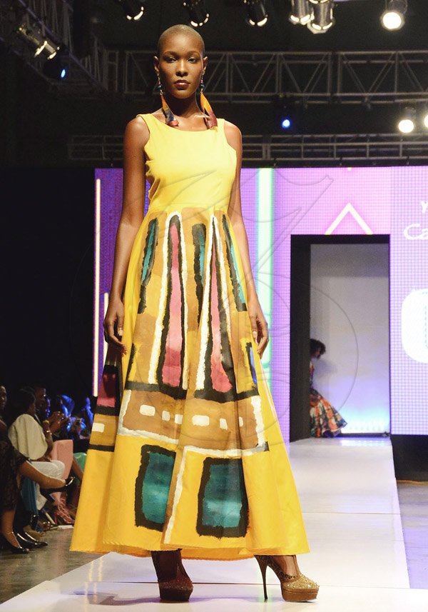 Winston Sill/Freelance Photographer<\n><\n>A model presents a Yesa design at the Caribbean Fashion Week (CFW) runway shiows opener on Friday at the National Indoor SDports Centre, Arthur Wint Drive, St Andrew.