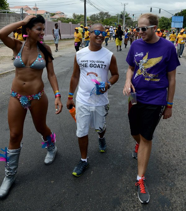 Winston Sill/Freelance Photographer
Bacchanal Jamaica Road Parade, from Mas Camp, Stadium North to Half Way Tree and back, held on Sunday April 27, 2014. Here are Danielle Croskill (left); Adrien Lemaire (centre); and Mayer Matalon 3rd (right).