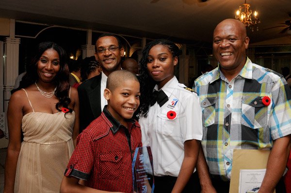 Winston Sill/Freelance Photographer
Caribbean Aviation Training Centre (CATC) Graduation and Awrds Dinner, held at the Mona Visitors' Lodge, Garden Lane, UWI Mona Campus on Saturday night October 12, 2013. Here are Annmarie Perry (left) Capt. Errol Stewart (second left); Shantell Perry (seond right), Top Female Student Pilot; Glenmore Perry (right); and Jaquan Perry in front.