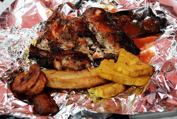 Winston Sill/Freelance Photographer
Jerk chicken, plantain and fried breadfruit covered with grace tomato ketchup - Charlett Dillon from St Ann.