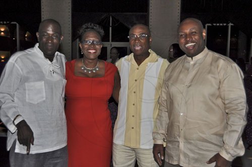 Janet Silvera Photo
 
Celebrating his survival from a near-death experience, Belizean Queens Council, Rodwell Williams (second right) is flanked by friends (from left) University of Technology lecturer, Kess Miller; Director of Public Prosecutions, Paula Llewellyn; and Solicitor General, Douglas Leys at a cocktail reception in his honour at the Iberostar Suites in Montego Bay last Saturday night.