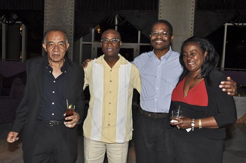 Janet Silvera Photo
 
The man of the moment, Belizean Queens Council and Norman Manley Law School graduate, Rodwell Williams (second left) is joined by (from left) attorneys, Garth McBean, and Garth and Beverly Givans at his cocktail reception.


 in his honour at the Iberostar Suites in Montego Bay last Saturday night.