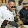 Rudolph Brown/Photographer
Agent Sasco, (left) and Chef Brian Lumley cooks at the Best Dressed Chicken Caters to you Celebrity Style at the Montego Bay Convention Centre on Sunday, October 13, 2013