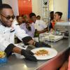 Rudolph Brown/Photographer
Agent Sasco serve Suean Ford at the Best Dressed Chicken Caters to you Celebrity Style cook off  with Agent Sasco and Chef Brian Lumley at the Montego Bay Convention Centre on Sunday, October 13, 2013