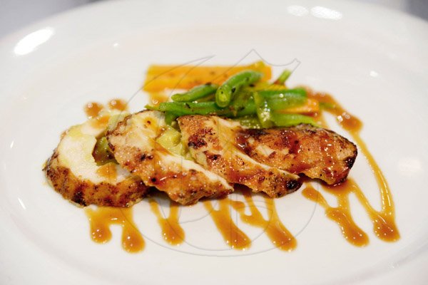 Rudolph Brown/Photographer
Stuffed chicken breast with sweet potato at the Best Dressed Chicken Caters to you Celebrity Style cook off  with Agent Sasco and Chef Brian Lumley at the Montego Bay Convention Centre on Sunday, October 13, 2013