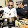 Rudolph Brown/Photographer
Agent Sasco, (left) and Chef Brian Lumley cooks at the Best Dressed Chicken Caters to you Celebrity Style  at the Montego Bay Convention Centre on Sunday, October 13, 2013