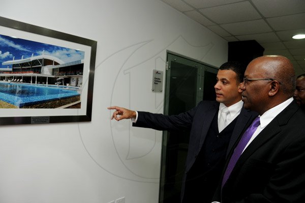 Winston Sill / Freelance Photographer
Function to mark the Official Launch of CEMEX Jamaica Limited new Corporate Office, held at the Courtleigh Corporate Centre, St. Lucia Avenue, New Kingston on Wednesday night February 20, 2013. Here are Rafael Villalona (left0, General Manager, CEMEX Jamaica Limited; and Dr. Morais Guy (right).