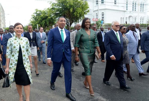 Shorn Hector/ Prime Minister Andrew Holness and wife Juliet, centre, leads members of parliament for the Jamaica Labour Party to Gordon House for  the Ceremonial Opening of the 2019/2020 Session of Parliament on February 14, 2019.